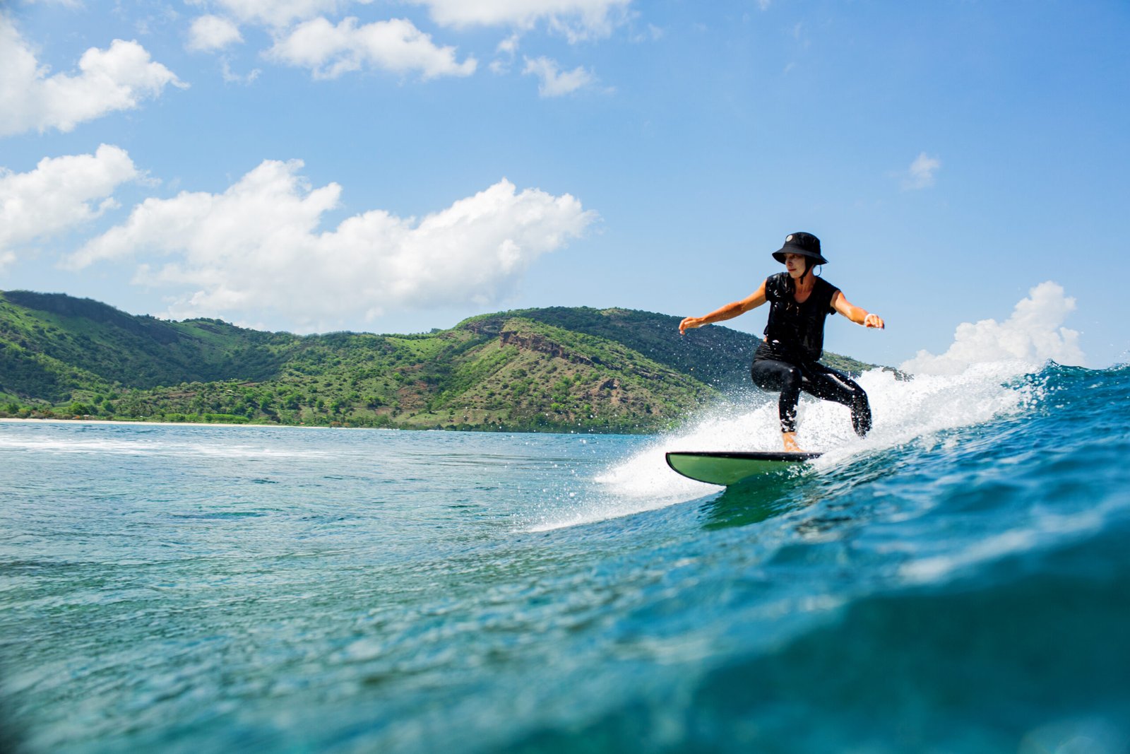 surfer on a blue wave